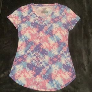 This is a juniors, fitted t-shirt. No boundaries, polyester and spandex blend.